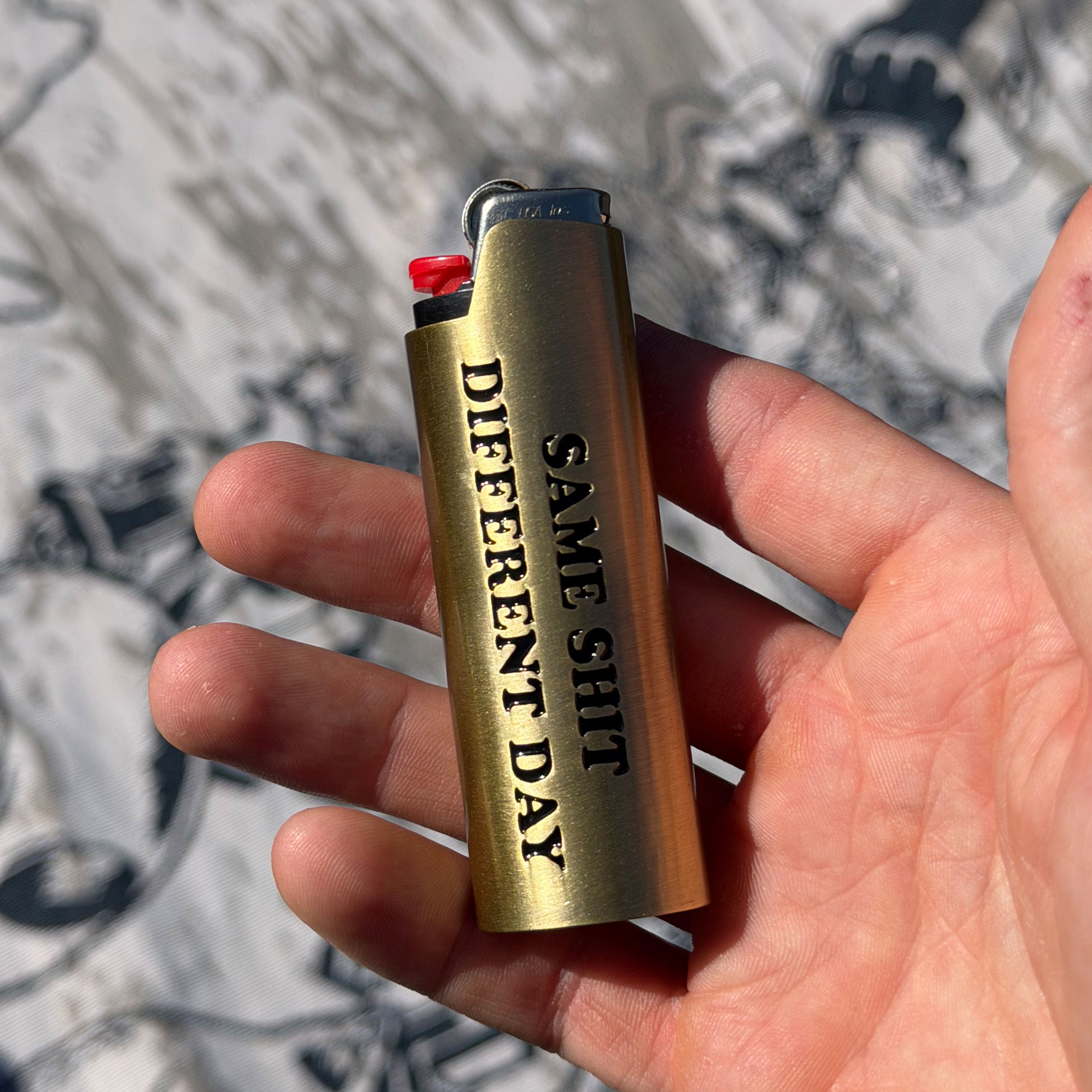 RIPNDIP Same Shit Different Day Lighter Cover (Gold)